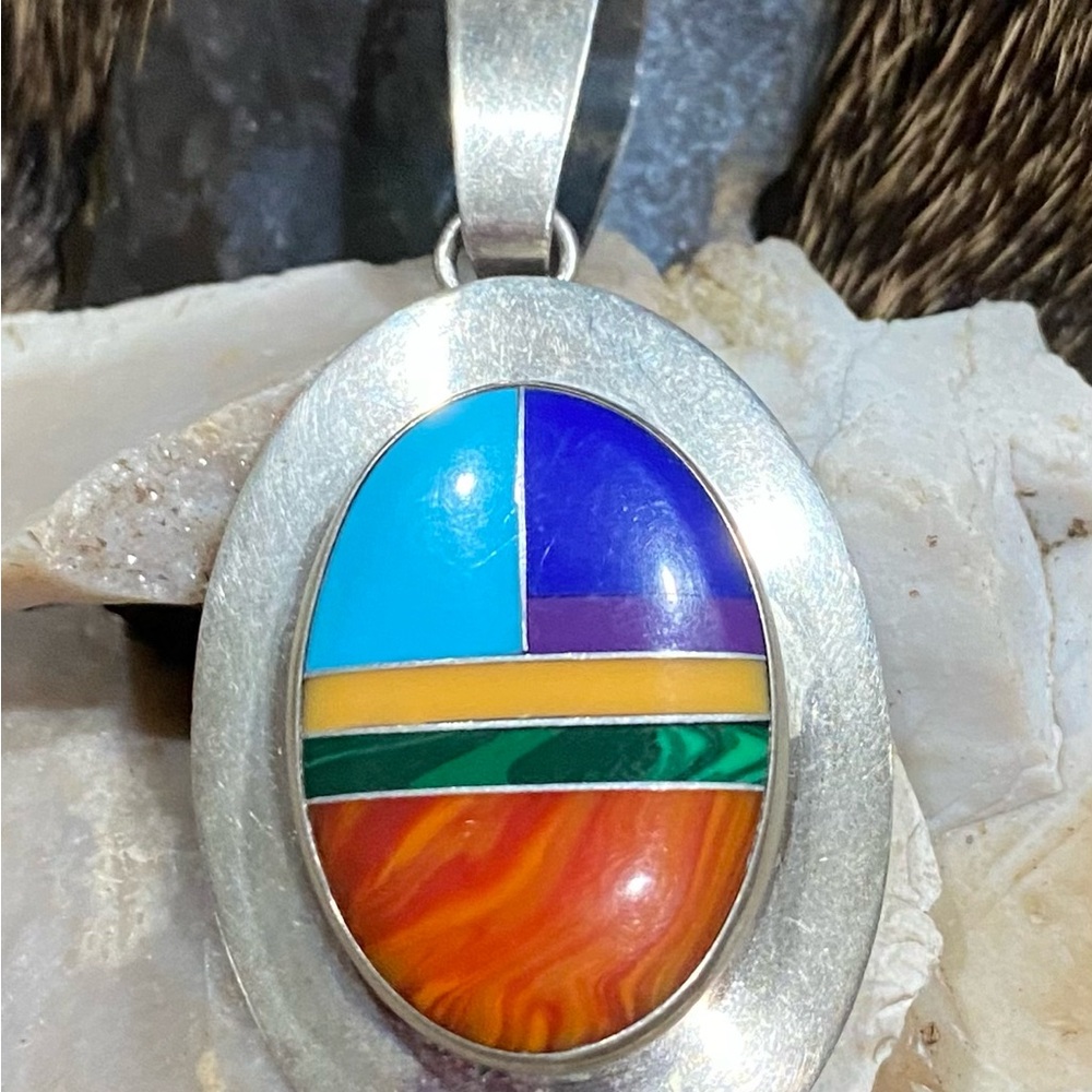 Inlaid NA pendant.